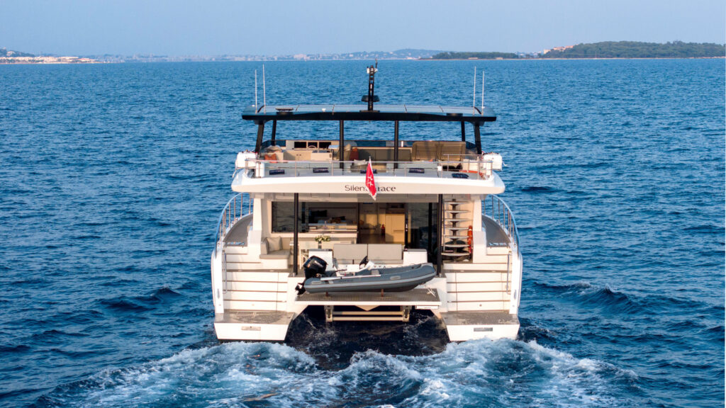 Solar-powered catamaran sailing in turquoise waters